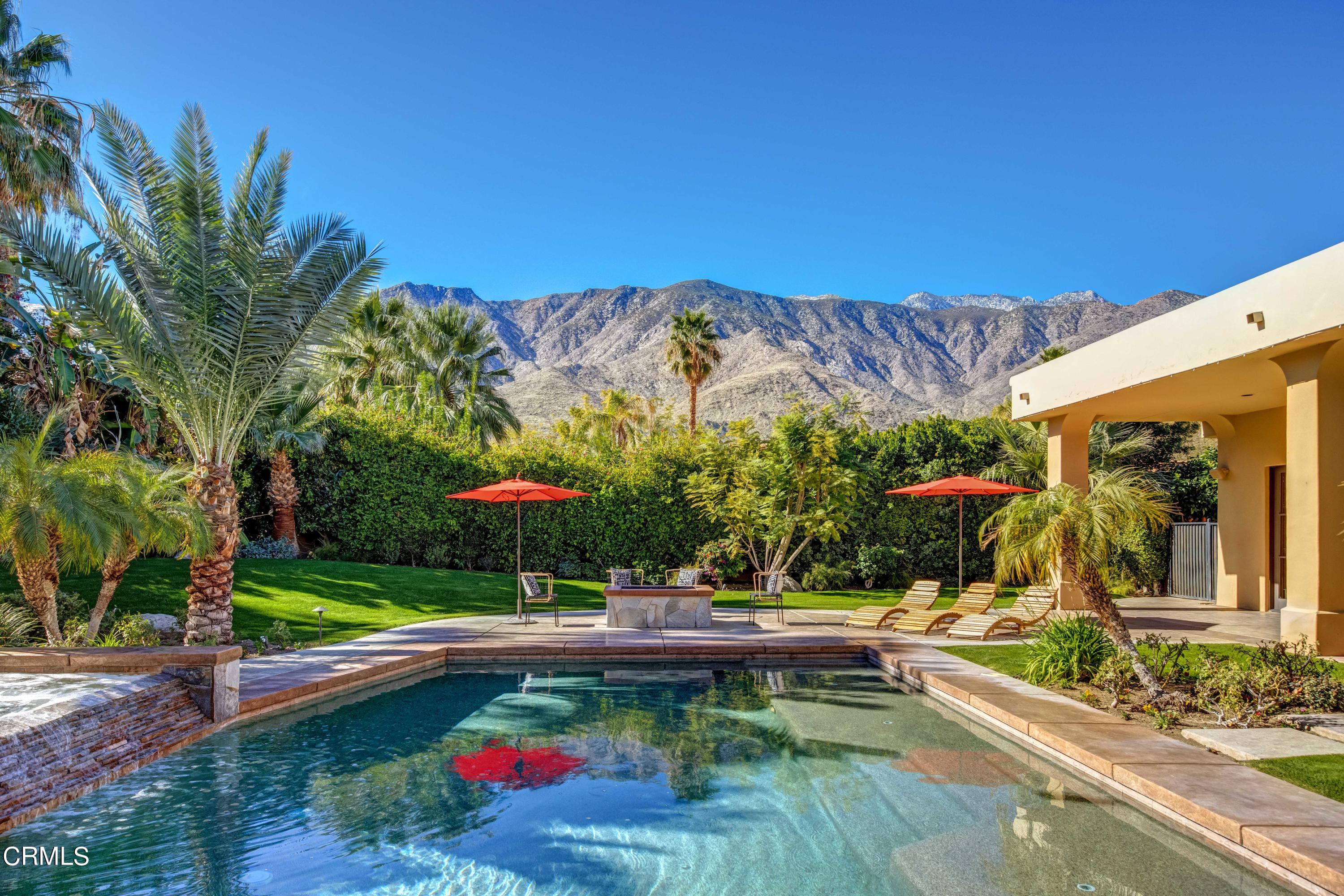 64435 Via Risso Palm Springs, CA 92264 - Photo 54 of 65 a view of a swimming pool with a lounge chairs