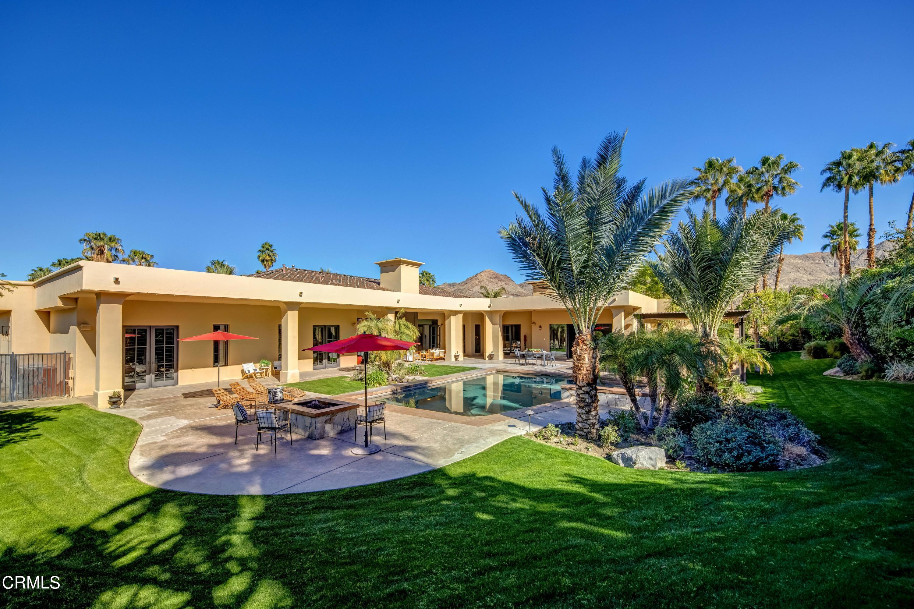 64435 Via Risso Palm Springs, CA 92264 - Photo 56 of 65 a view of a house with a backyard porch and sitting area