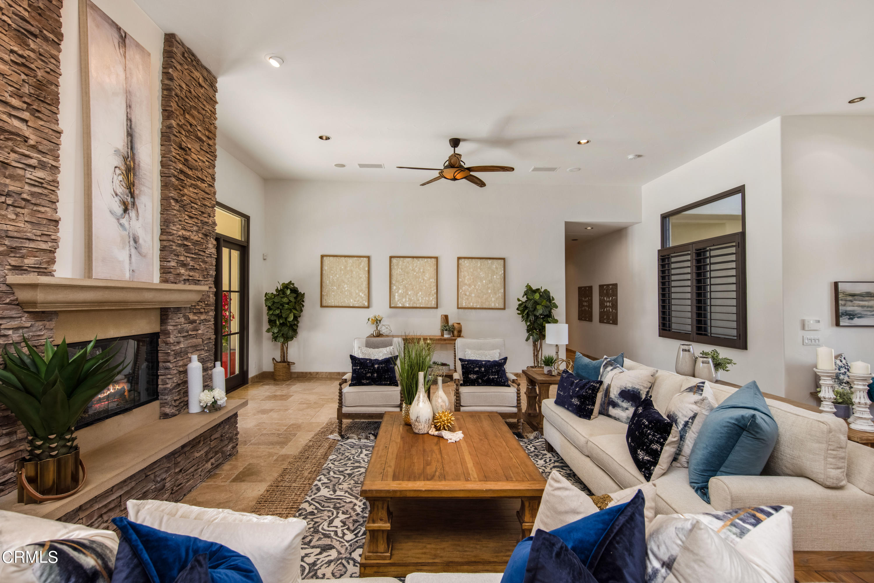 64435 Via Risso Palm Springs, CA 92264 - Photo 10 of 65 a living room with furniture a fireplace and a potted plant
