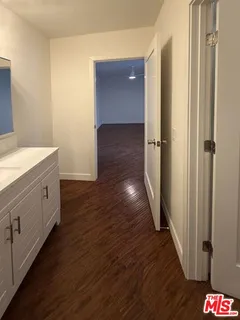 a bathroom with sink and mirror