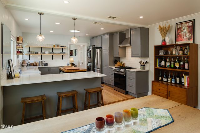 a room with furniture a rug and a window