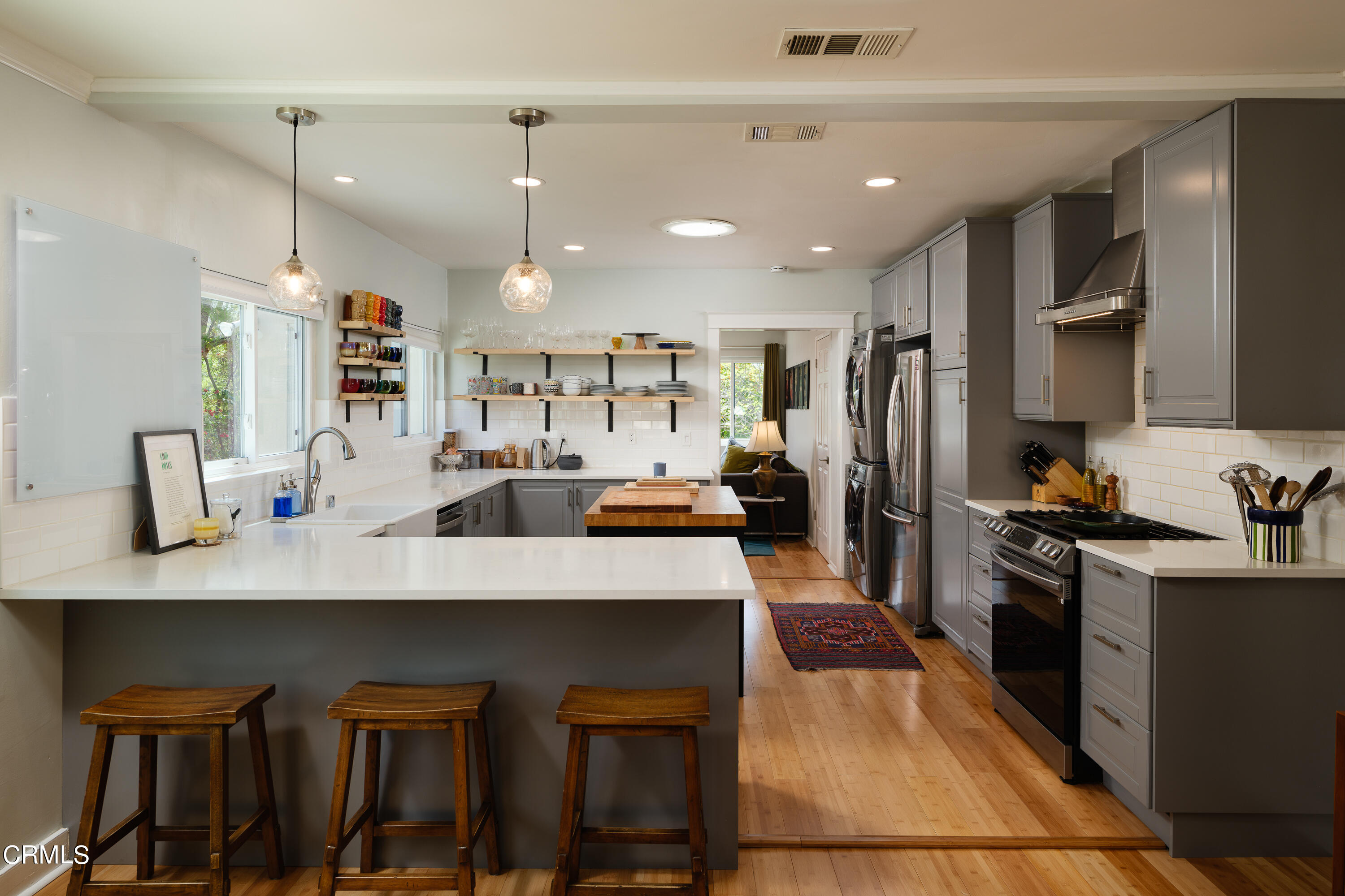 1794 Beverly Drive Pasadena, CA 91104 - Photo 14 of 56 a kitchen with kitchen island a refrigerator stove and sink