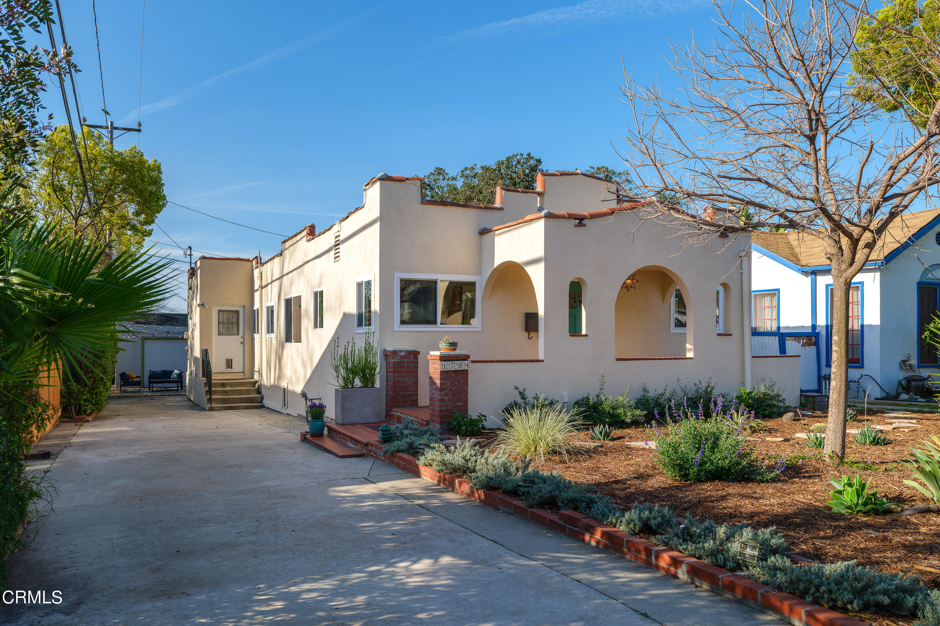 1794 Beverly Drive Pasadena, CA 91104 - Photo 2 of 56 a front view of a house with a garden