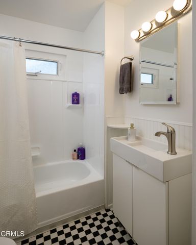 a bedroom with furniture and a book shelf