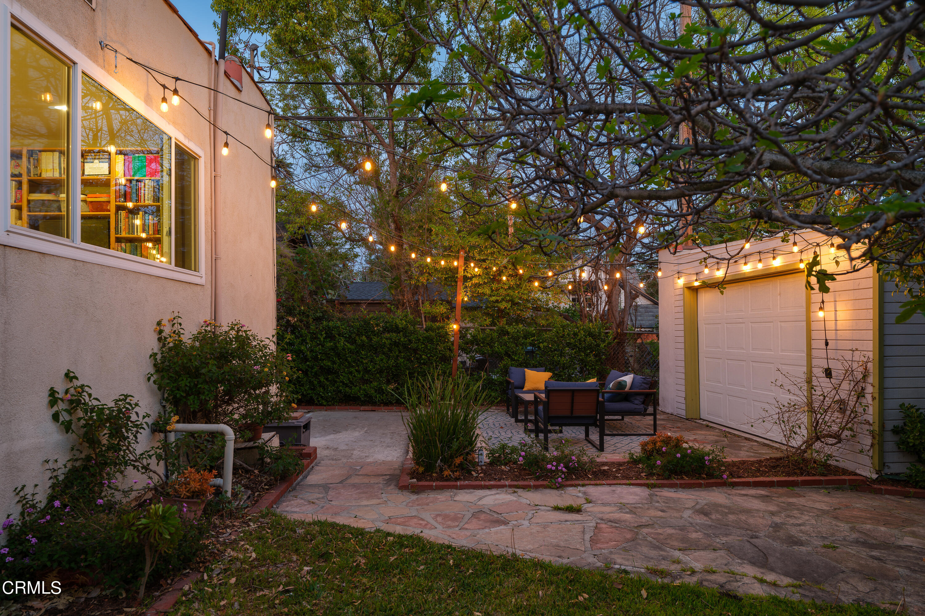 1794 Beverly Drive Pasadena, CA 91104 - Photo 55 of 56 a view of a patio with table and chairs potted plants and large tree