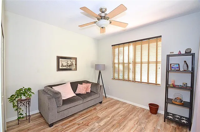 a living room with furniture and a window