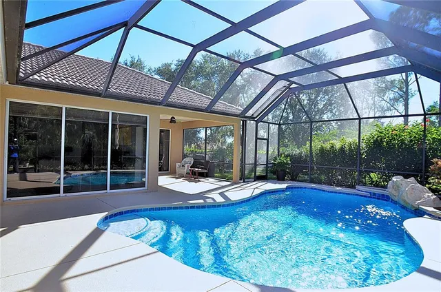 a view of a swimming pool with a patio