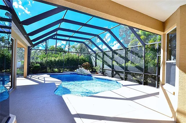 a view of swimming pool with an outdoor seating