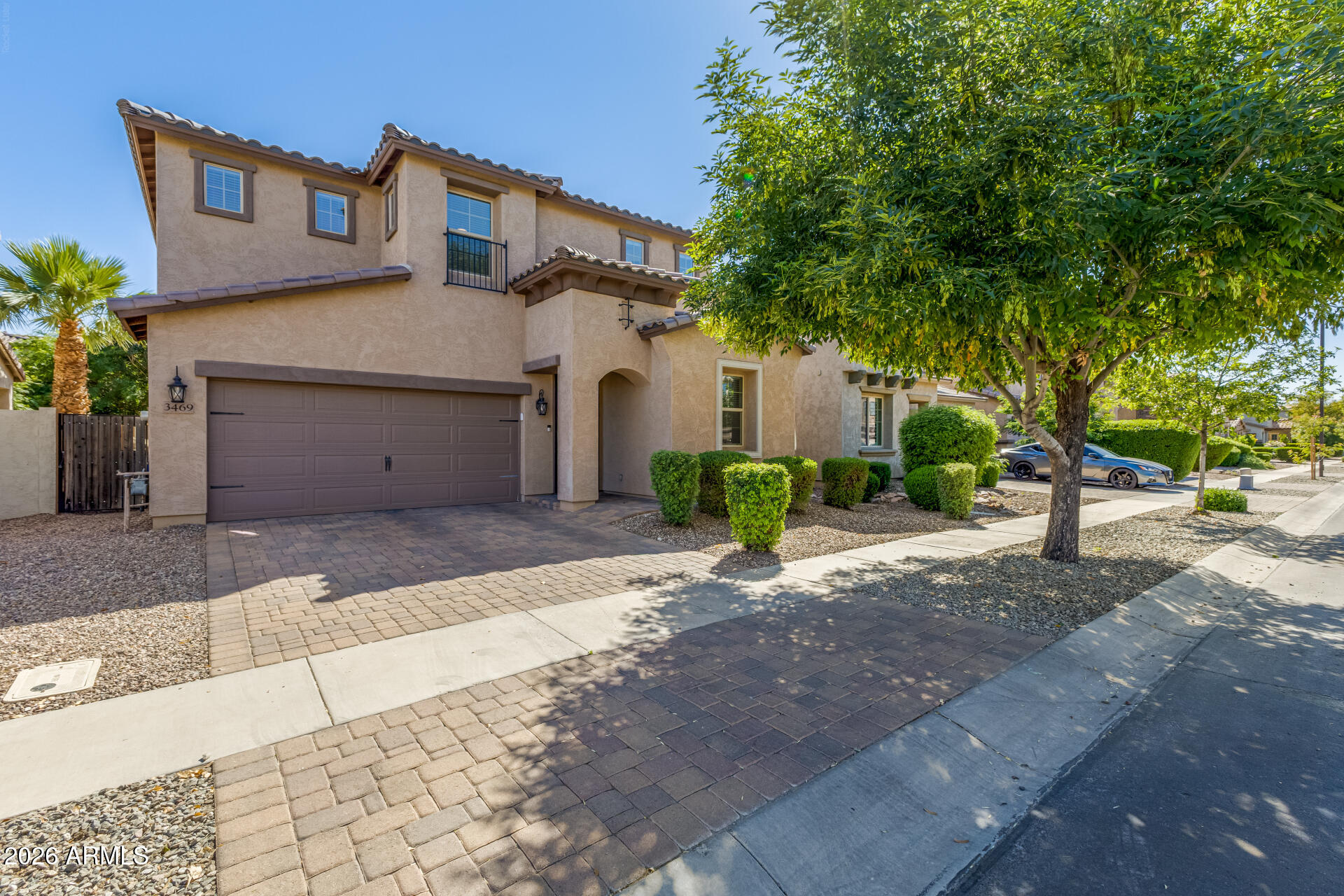 3469 East Indigo Street Gilbert, AZ 85298 - Photo 1 of 32 a front view of a house with a yard and a garage