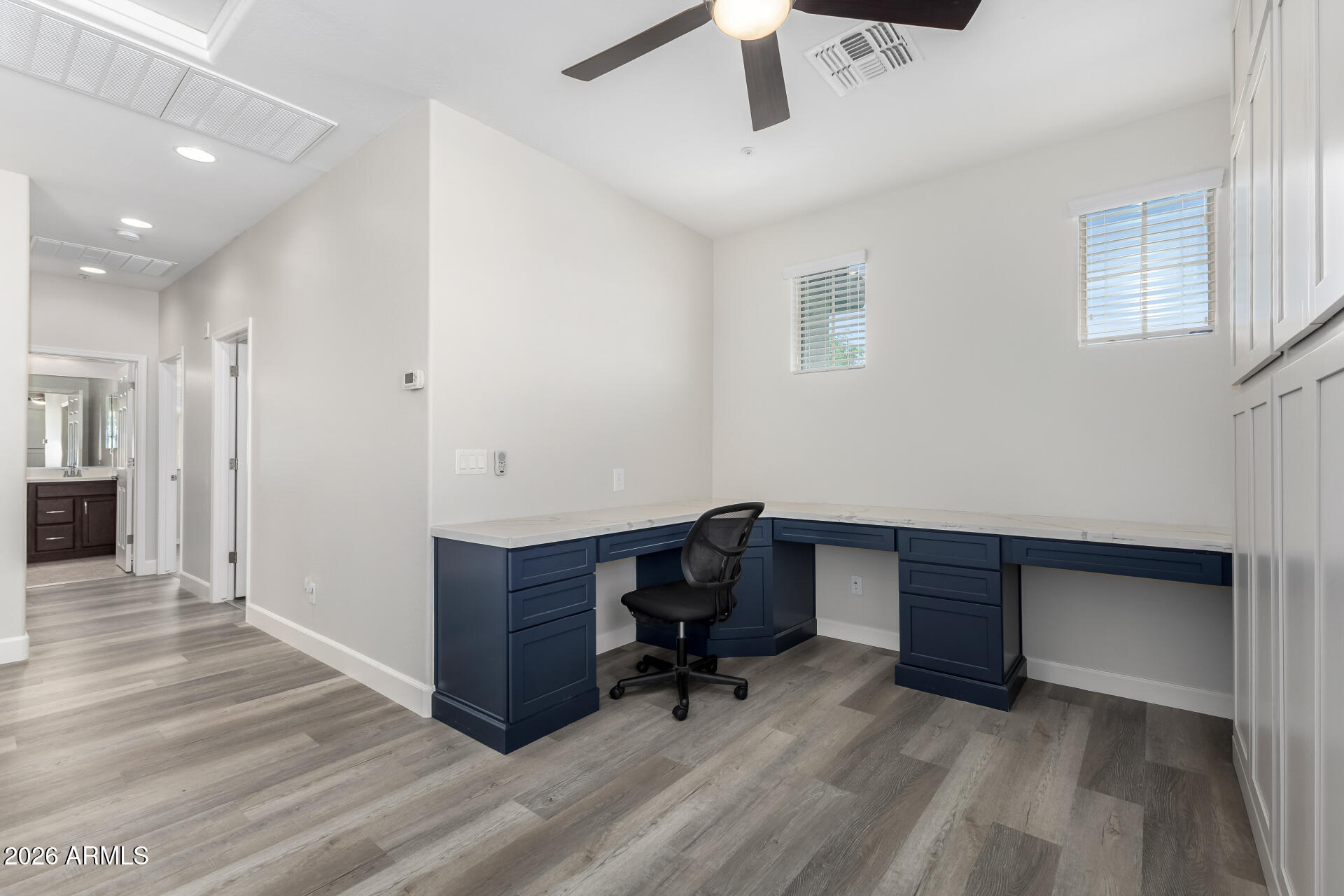 3469 East Indigo Street Gilbert, AZ 85298 - Photo 12 of 32 a view of a workspace with furniture and a window