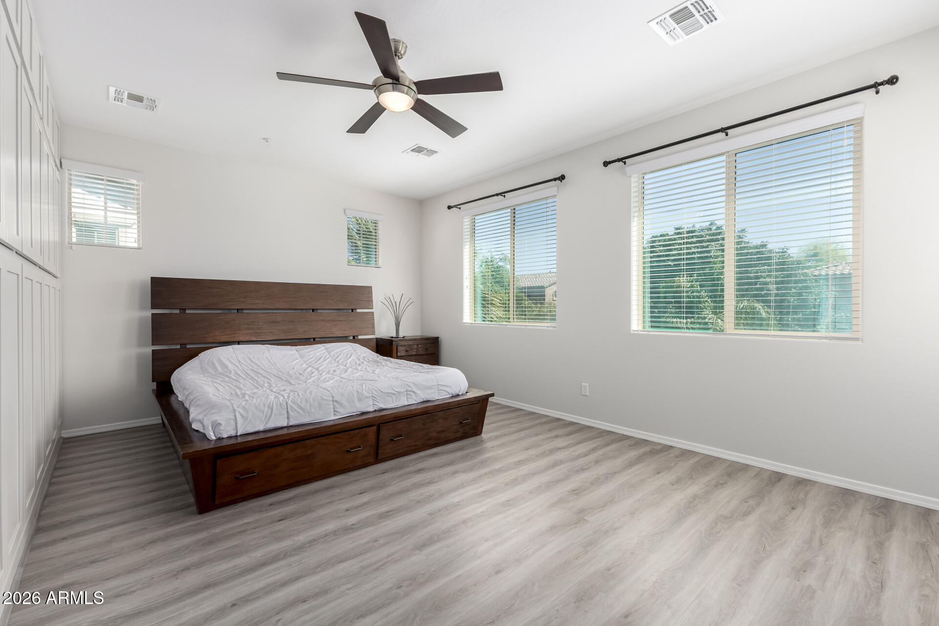 3469 East Indigo Street Gilbert, AZ 85298 - Photo 13 of 32 a bedroom with a large bed and a window