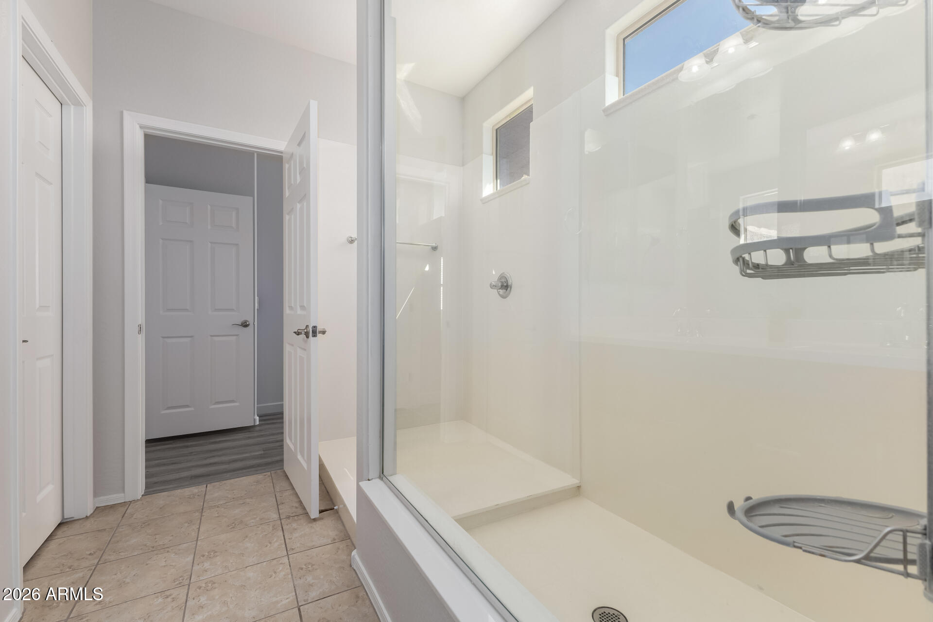 3469 East Indigo Street Gilbert, AZ 85298 - Photo 17 of 32 a bathroom with a tub and shower