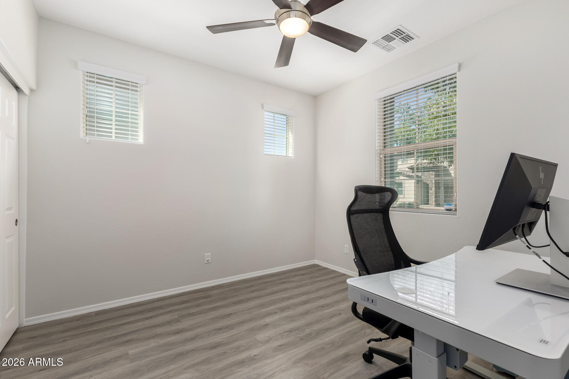 3469 East Indigo Street Gilbert, AZ 85298 - Photo 19 of 32 a view of a workspace with furniture and a window