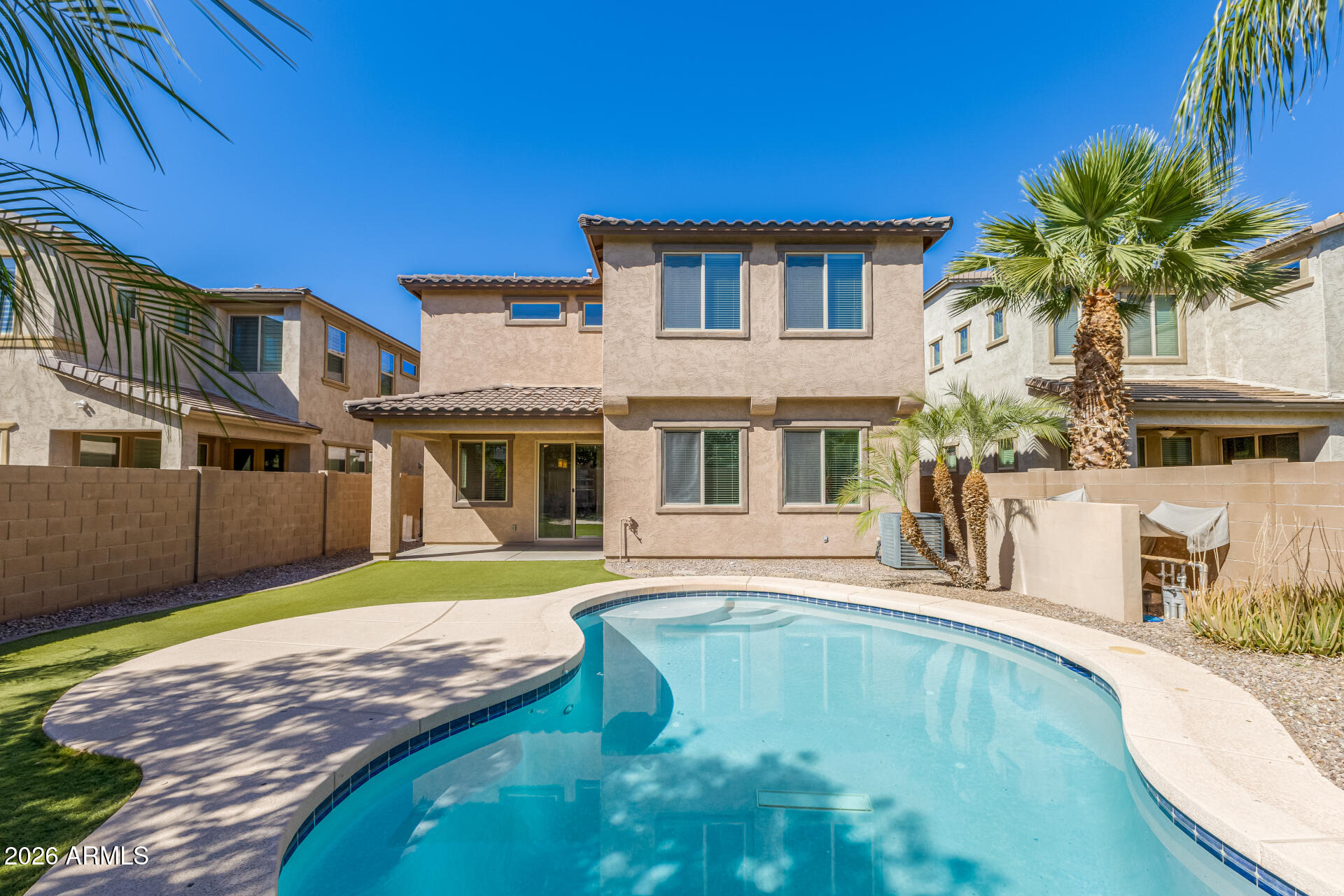 3469 East Indigo Street Gilbert, AZ 85298 - Photo 2 of 32 a view of a house with a swimming pool