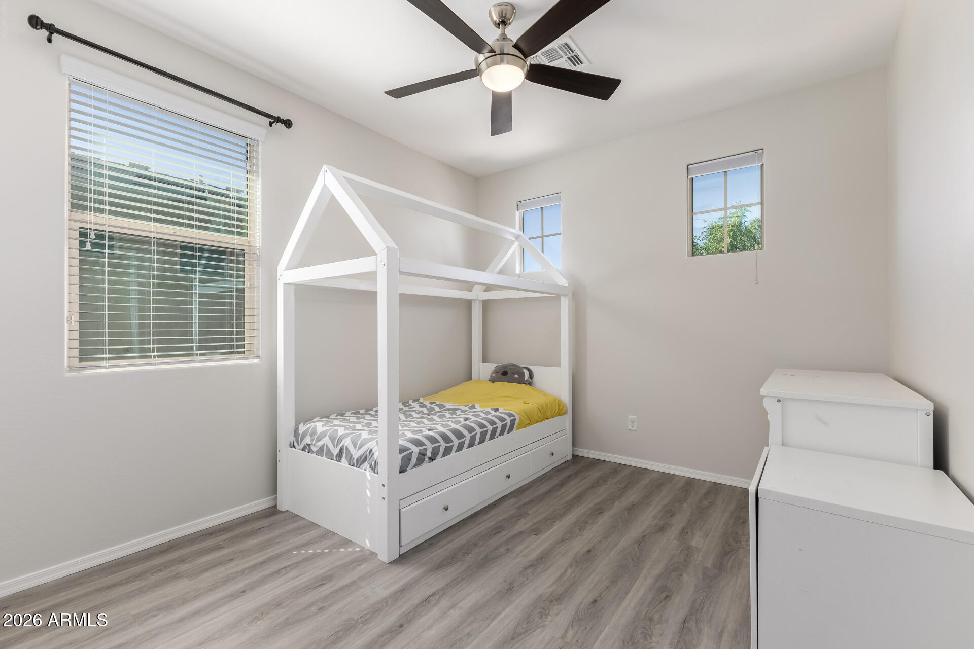 3469 East Indigo Street Gilbert, AZ 85298 - Photo 24 of 32 a bedroom with a bed and a window