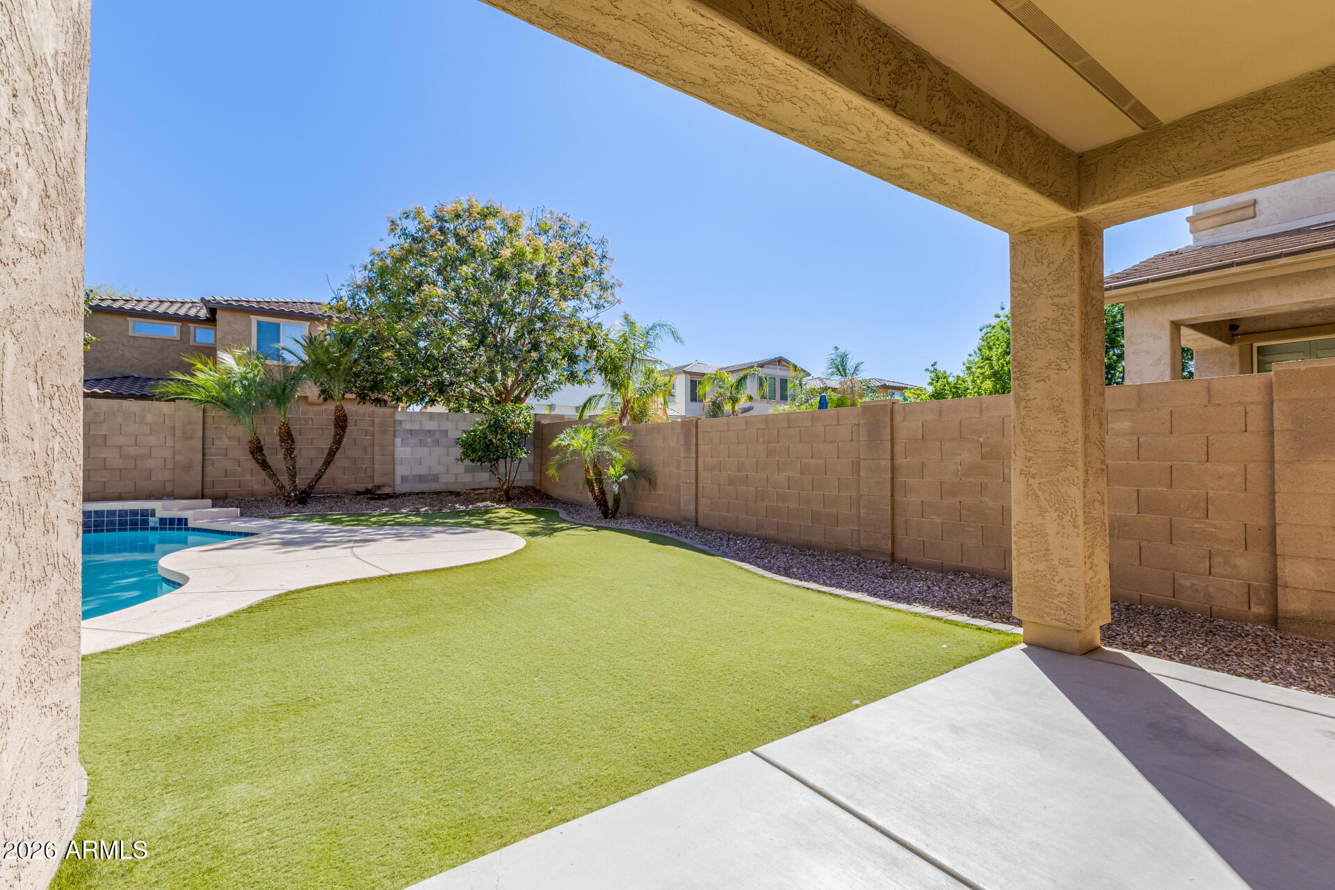 3469 East Indigo Street Gilbert, AZ 85298 - Photo 29 of 32 a view of a backyard with a small cabin
