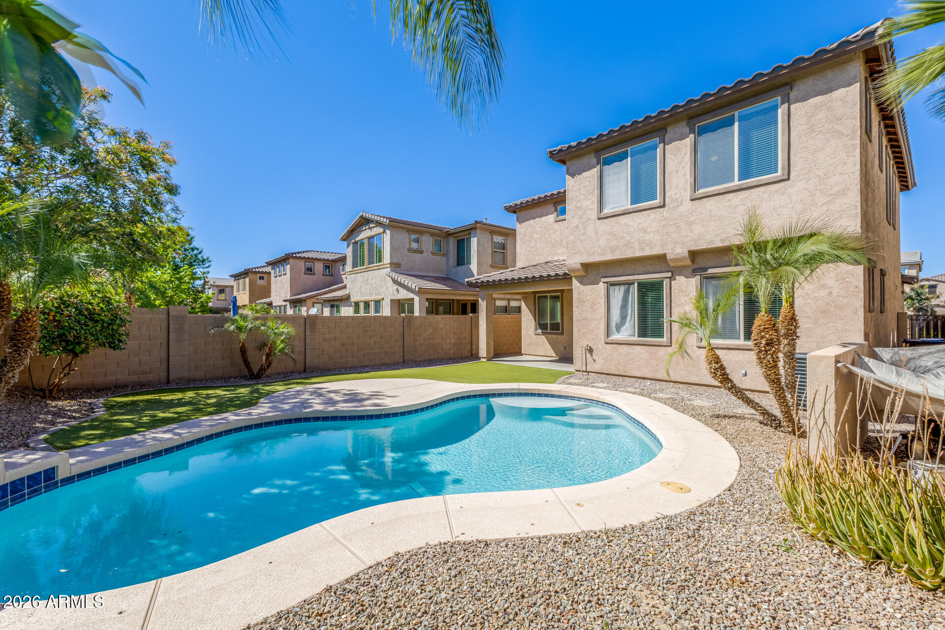 3469 East Indigo Street Gilbert, AZ 85298 - Photo 31 of 32 a view of a house with swimming pool