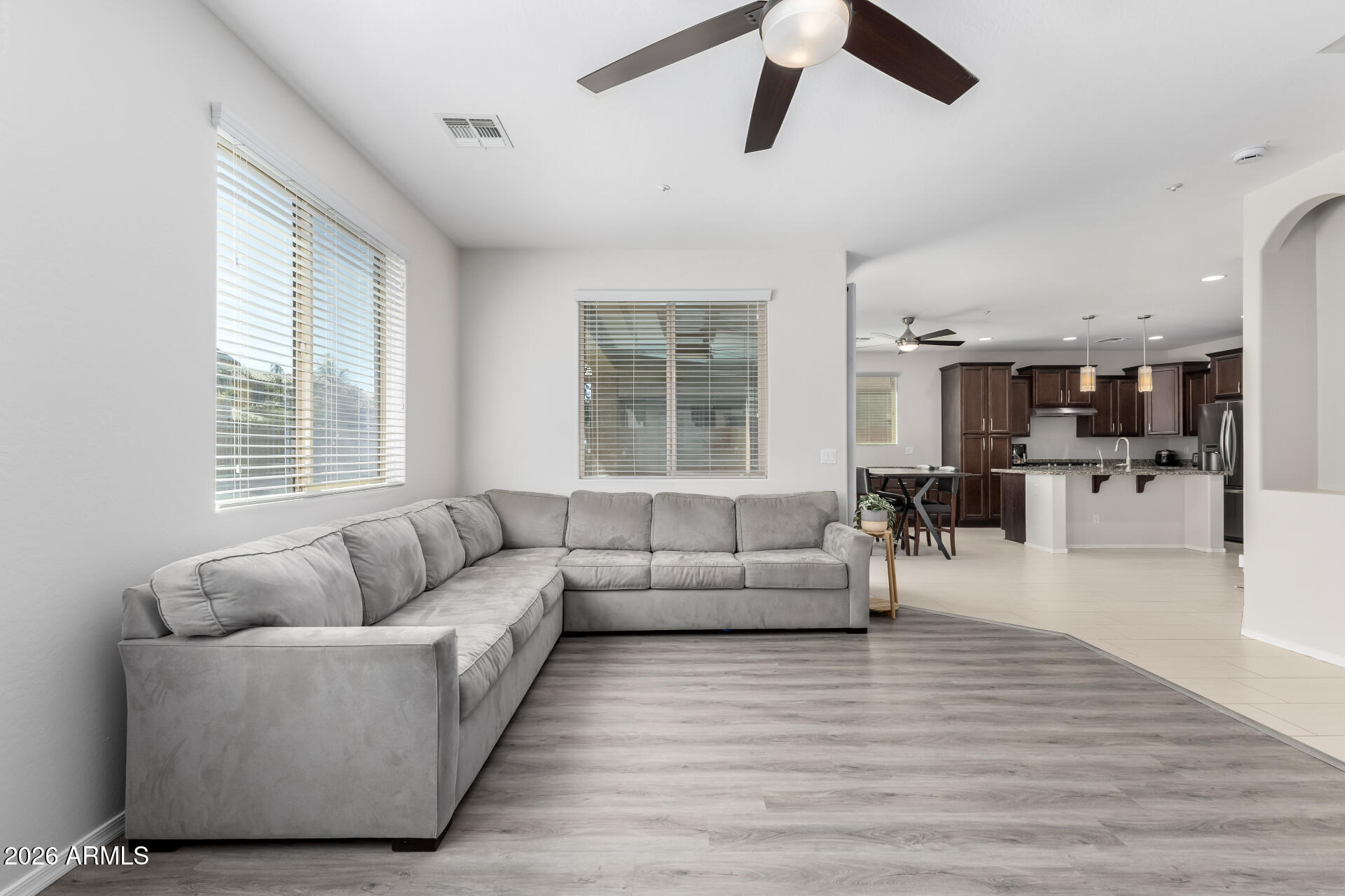3469 East Indigo Street Gilbert, AZ 85298 - Photo 7 of 32 a living room with furniture and a large window