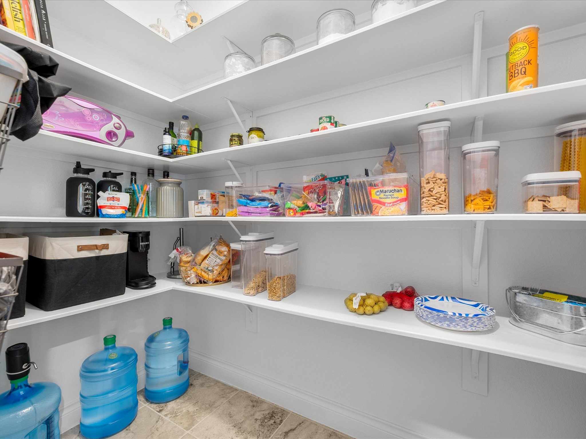 12618 Ranger Court Magnolia, TX 77354 - Photo 19 of 45 This walk-in pantry is a dedicated, accessible storage space off the kitchen designed to hold dry goods, bulk groceries, and small appliances