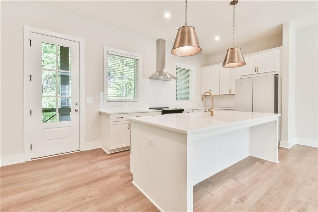 235 Firefly Circle Alpharetta, GA 30009 - Photo 11 of 30 a kitchen with a sink cabinets and window