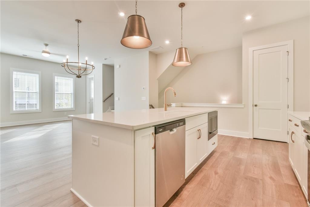 235 Firefly Circle Alpharetta, GA 30009 - Photo 13 of 30 a spacious bathroom with a double vanity sink a mirror and a bathtub