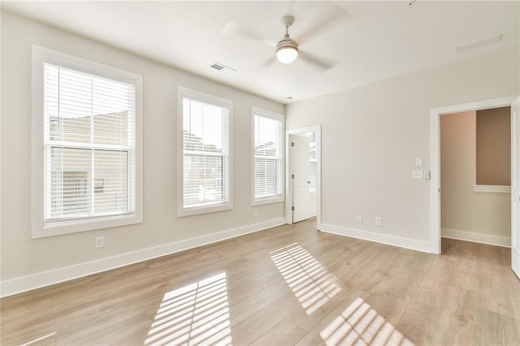 235 Firefly Circle Alpharetta, GA 30009 - Photo 25 of 30 a view of an empty room with a window and a kitchen