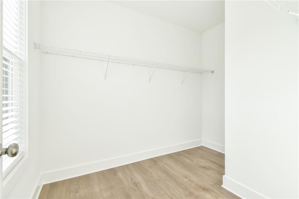 235 Firefly Circle Alpharetta, GA 30009 - Photo 28 of 30 a view of small space with racks on the wall