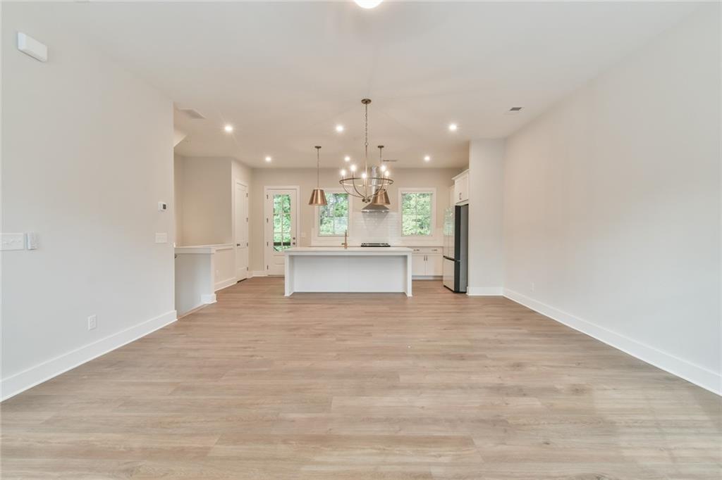 235 Firefly Circle Alpharetta, GA 30009 - Photo 6 of 30 a view of an empty room and kitchen view