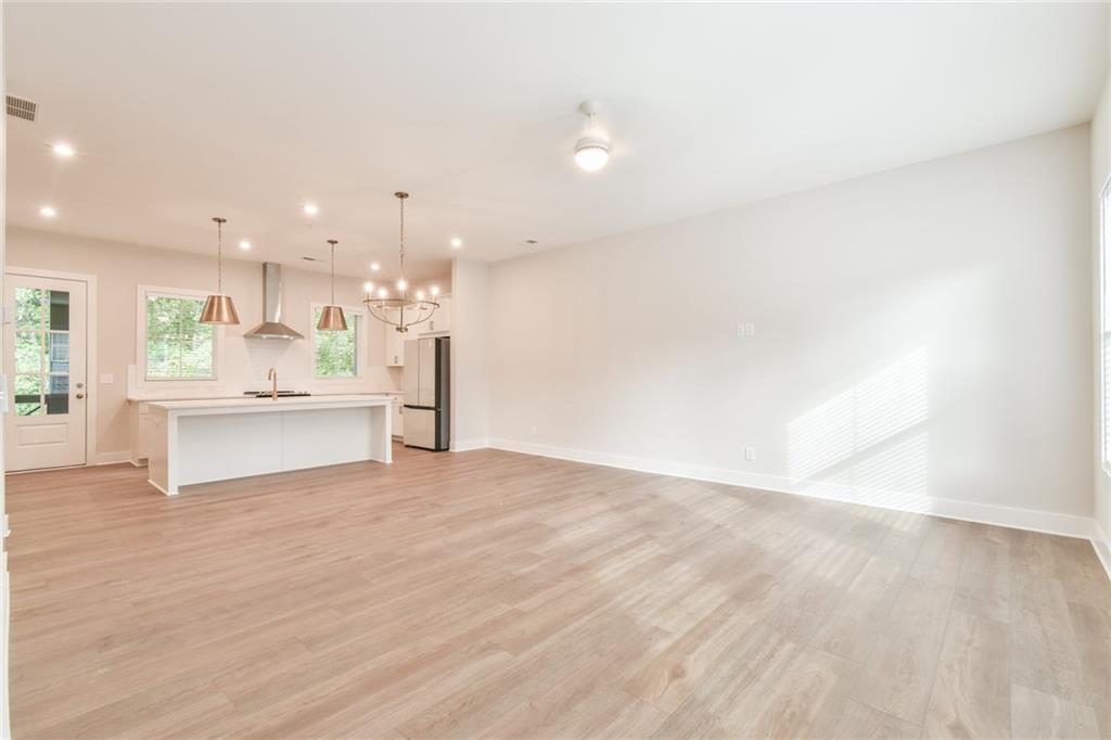 235 Firefly Circle Alpharetta, GA 30009 - Photo 8 of 30 a view of kitchen with kitchen island and stainless steel appliances