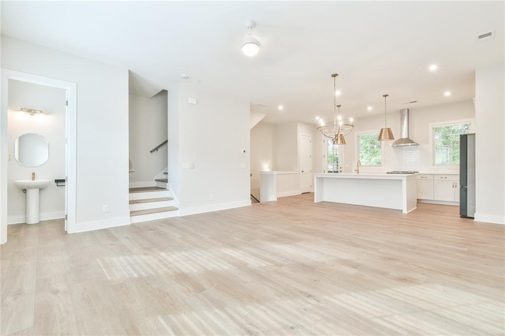 235 Firefly Circle Alpharetta, GA 30009 - Photo 9 of 30 a view of a kitchen with a sink and a stove
