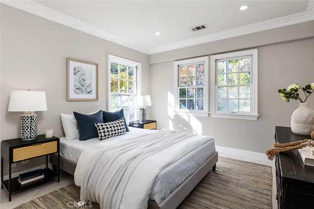 a bedroom with bed and a window