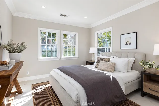 a bedroom with bed and a window