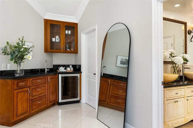 a view of cabinets a oven and a potted plant