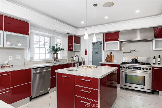 a kitchen with a stove a sink and a refrigerator