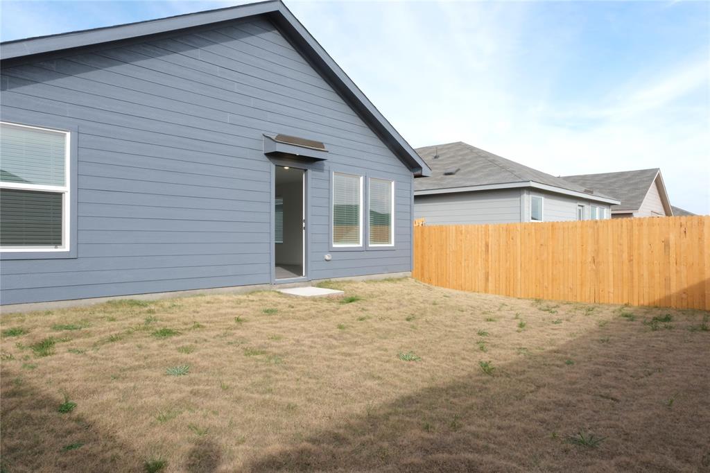 932 Calley Pear Trail Princeton, TX 75407 - Photo 15 of 16 a view of an house with backyard and garage