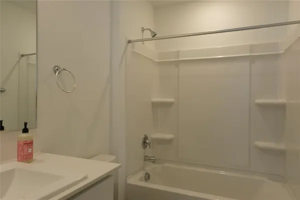 a bathroom with a shower and a bath tub