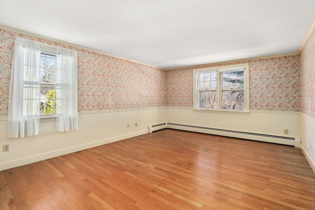 61 Walnut Street Shrewsbury, MA 01545 - Photo 18 of 38 an empty room with wooden floor and windows