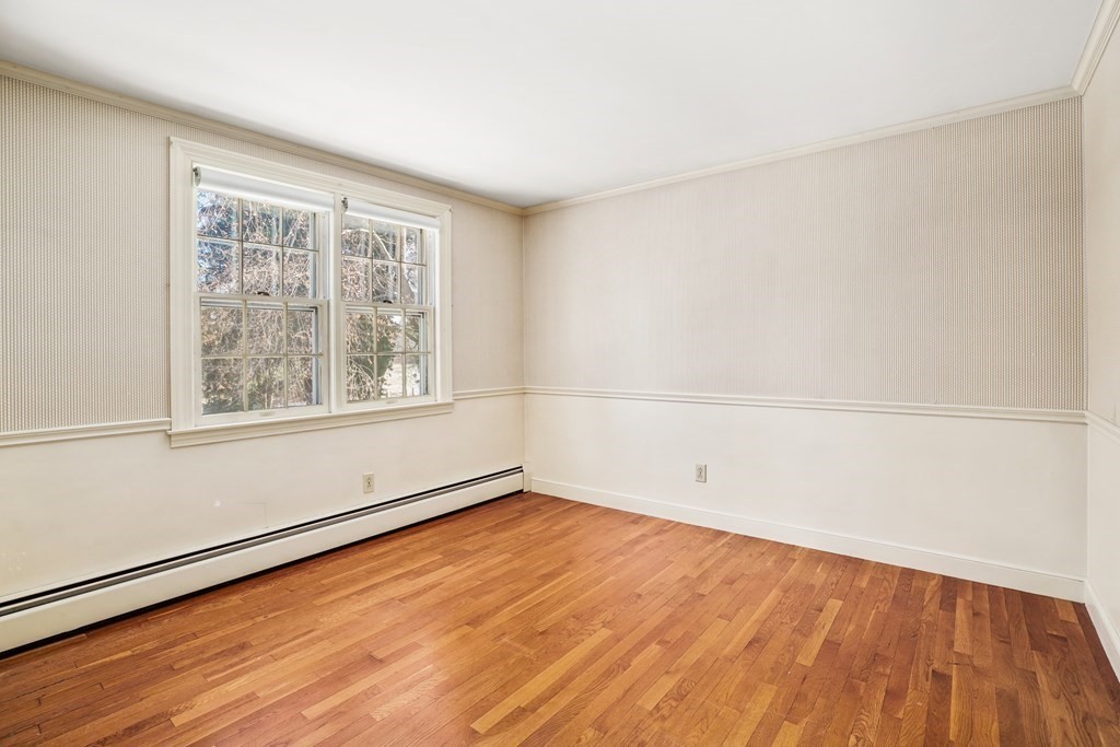 61 Walnut Street Shrewsbury, MA 01545 - Photo 22 of 38 wooden floor in an empty room with a window