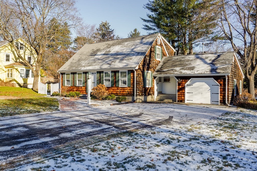 61 Walnut Street Shrewsbury, MA 01545 - Photo 25 of 38 a front view of a house with a big yard and large trees