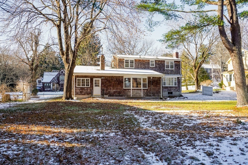 61 Walnut Street Shrewsbury, MA 01545 - Photo 29 of 38 a front view of a house with a yard table and chairs