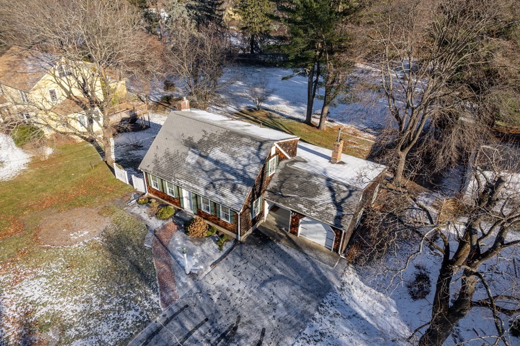 61 Walnut Street Shrewsbury, MA 01545 - Photo 33 of 38 a view of a backyard with wooden fence and large trees