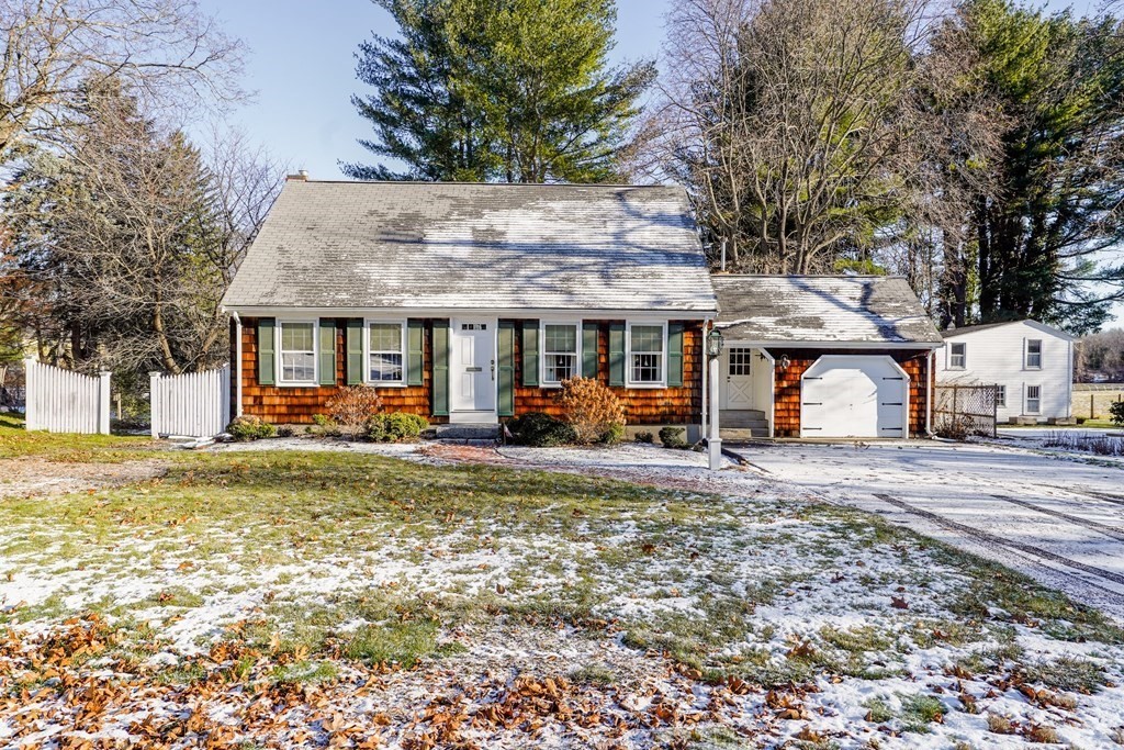 61 Walnut Street Shrewsbury, MA 01545 - Photo 37 of 38 a front view of a house with a garden and trees