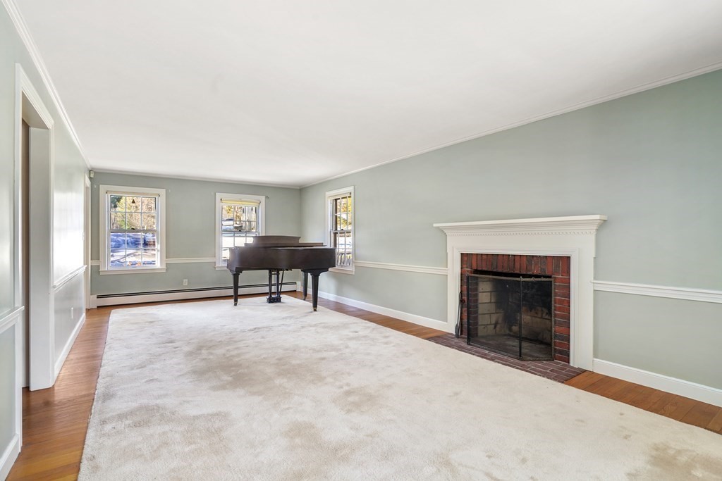 61 Walnut Street Shrewsbury, MA 01545 - Photo 8 of 38 a living room with furniture and a fireplace