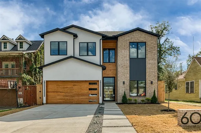 a front view of a house with garage