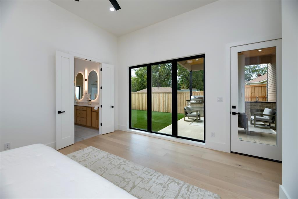 6038 Prospect Avenue Dallas, TX 75206 - Photo 12 of 40 a view of a hallway with wooden floor and windows