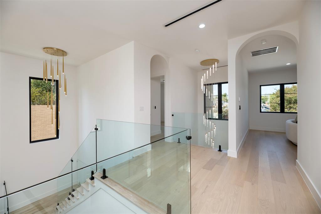 6038 Prospect Avenue Dallas, TX 75206 - Photo 20 of 40 a view of an entryway with wooden floor and a mirror