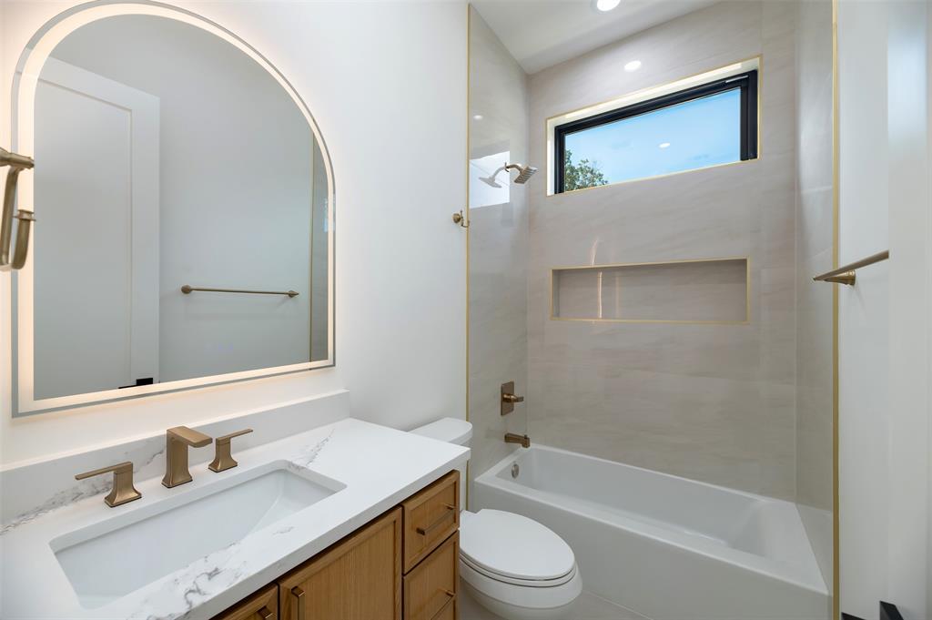 6038 Prospect Avenue Dallas, TX 75206 - Photo 27 of 40 a bathroom with a sink a toilet and shower