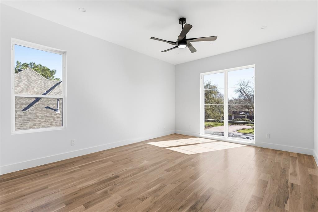 6257 Turner Way Dallas, TX 75230 - Photo 22 of 39 wooden floor in an empty room with a window