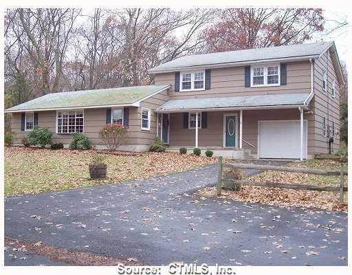 18 Monk Road Old Saybrook, CT 06475 - Photo 1 of 1 a front view of a house with yard