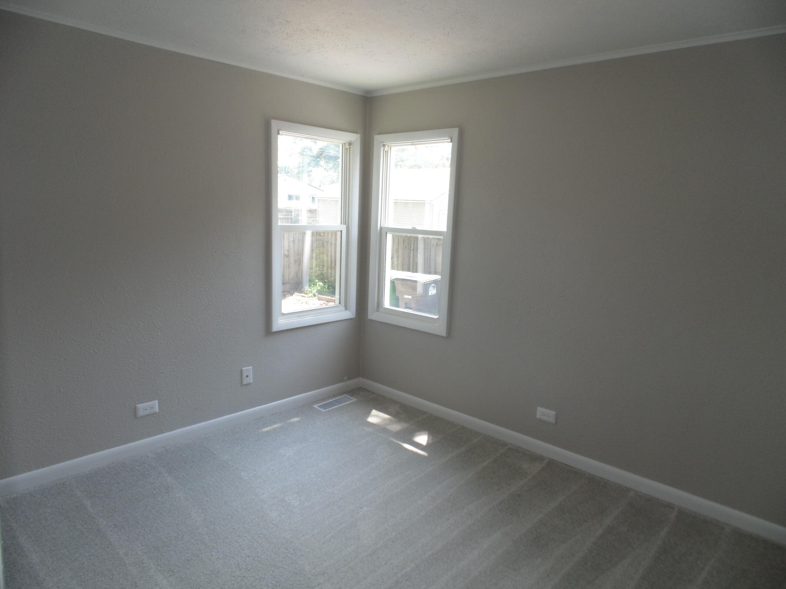 2919 State Street Lake Station, IN 46405 - Photo 15 of 28 an empty room with windows and closet